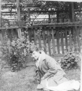 Ellen as a young woman in the yard on 21st Ave