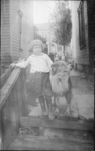 Paul Behe at home with his collie on 21st Ave